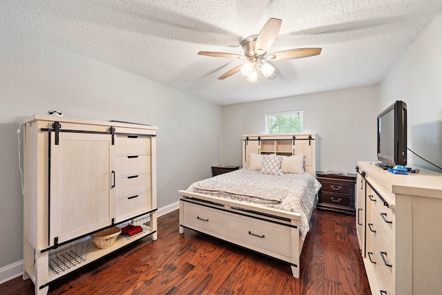 bedroom featuring a textured ceiling, ceiling fan, and dark hardwood / wood-style floors