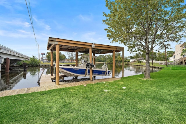 view of dock with a yard and a water view