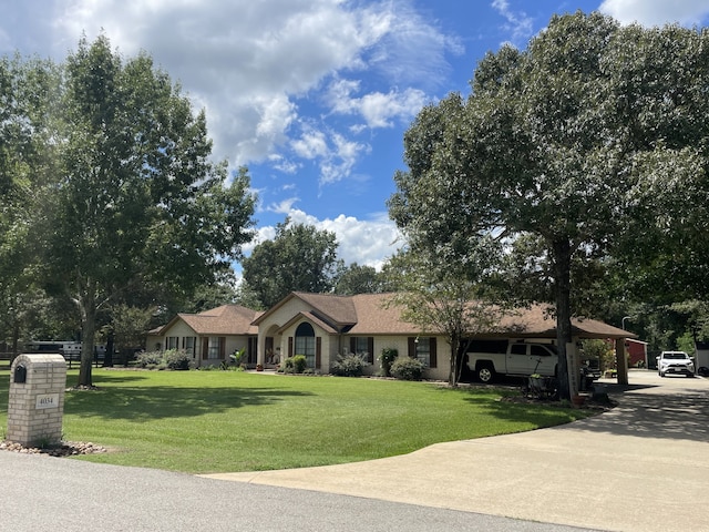 ranch-style house with a front lawn and a carport