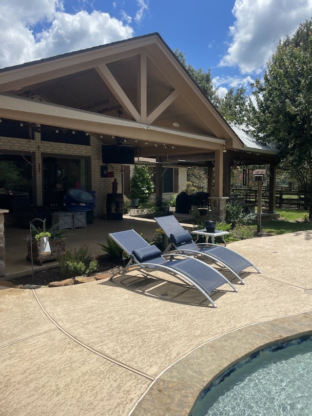 view of patio featuring a pool