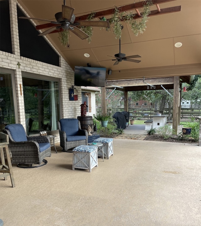 view of patio / terrace with area for grilling and ceiling fan