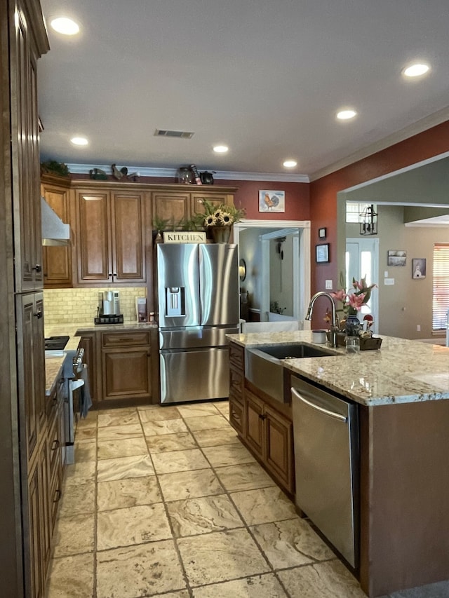 kitchen featuring sink, stainless steel appliances, light stone counters, backsplash, and ornamental molding