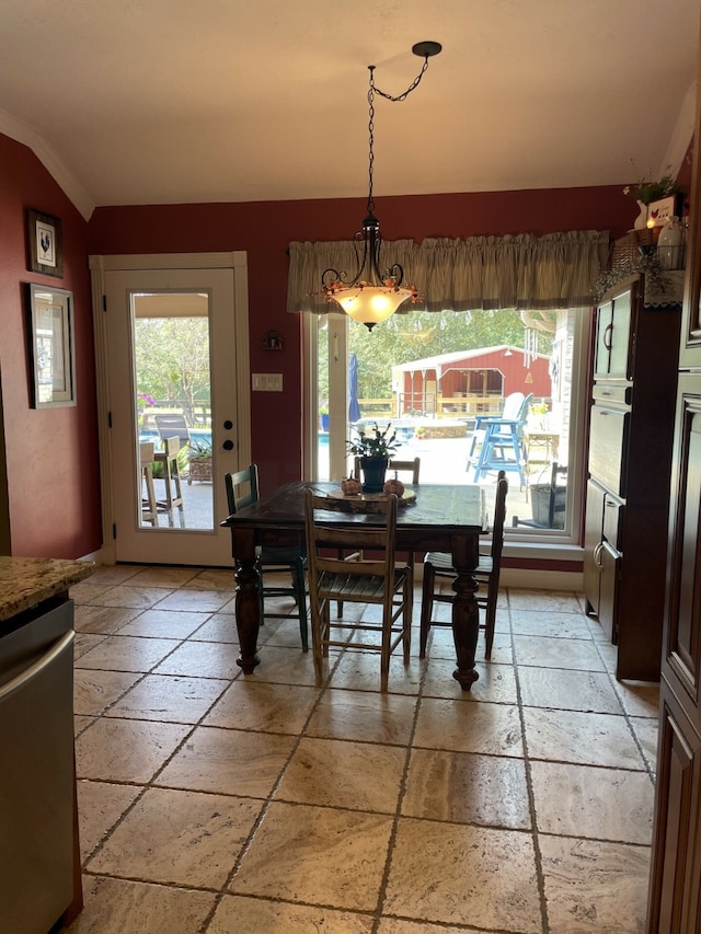 dining room featuring vaulted ceiling