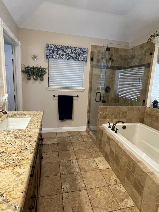 bathroom featuring vanity and separate shower and tub