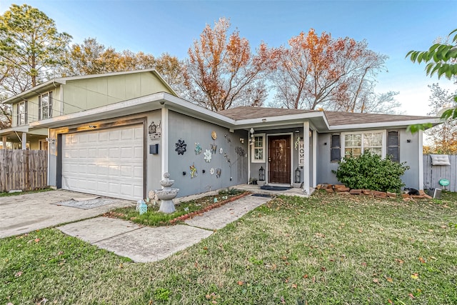 single story home featuring a front yard and a garage