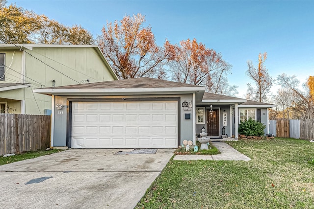 view of front facade with a front yard and a garage