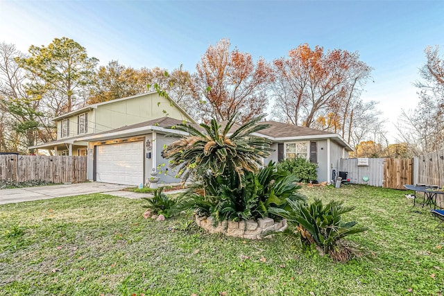 view of front of property with a garage, a trampoline, and a front yard