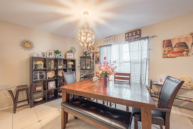 dining room featuring tile patterned floors and a notable chandelier