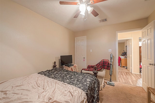 carpeted bedroom featuring ceiling fan