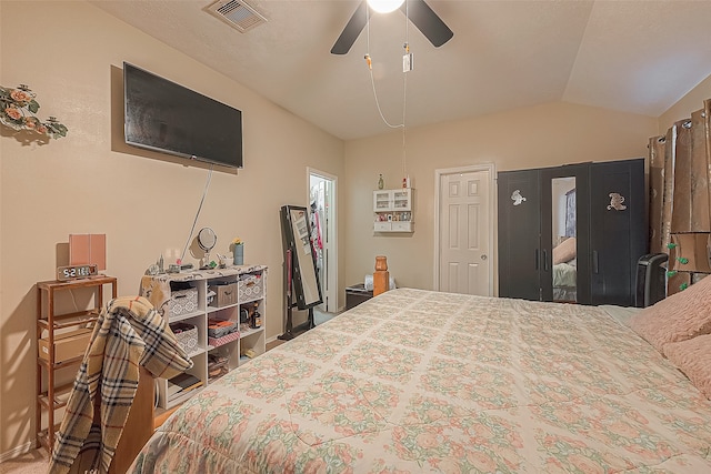 bedroom featuring ceiling fan and lofted ceiling