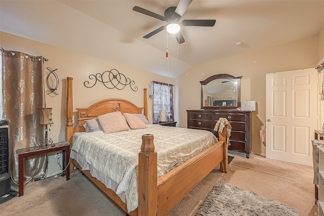 carpeted bedroom with vaulted ceiling and ceiling fan