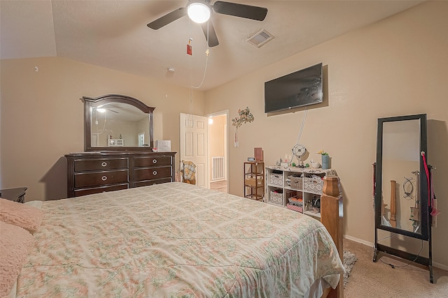 bedroom featuring ceiling fan, light colored carpet, and lofted ceiling