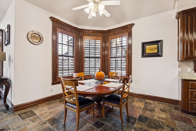 dining space featuring ceiling fan