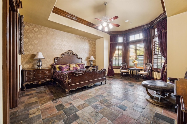 bedroom with ceiling fan and crown molding