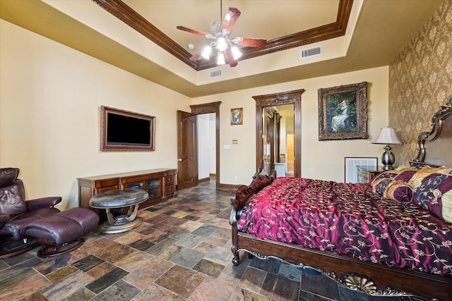 bedroom with a raised ceiling, ceiling fan, and crown molding