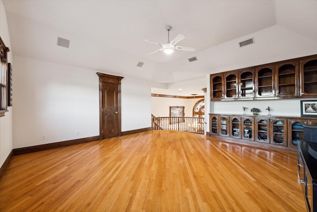 unfurnished living room with hardwood / wood-style floors and ceiling fan