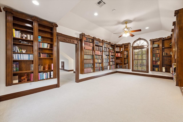 unfurnished room with ceiling fan, light carpet, and vaulted ceiling