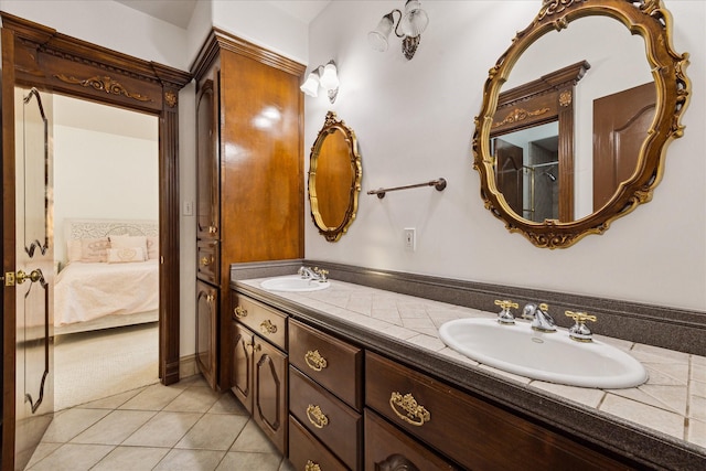 bathroom with tile patterned floors and vanity