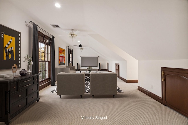 office area with ceiling fan, light colored carpet, and lofted ceiling