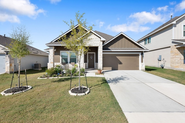 craftsman house featuring central AC, a garage, and a front yard