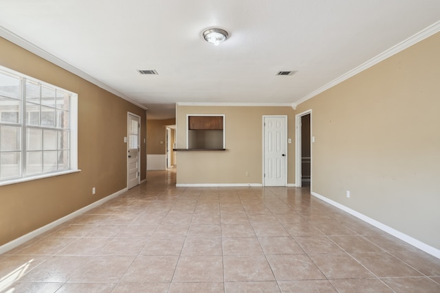 unfurnished living room featuring ornamental molding and light tile patterned floors