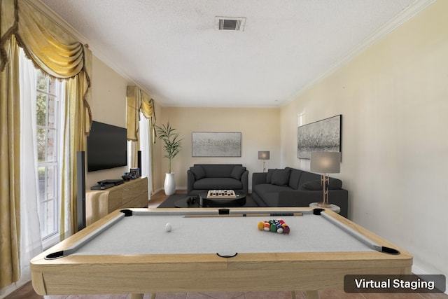 recreation room featuring ornamental molding, pool table, and a textured ceiling