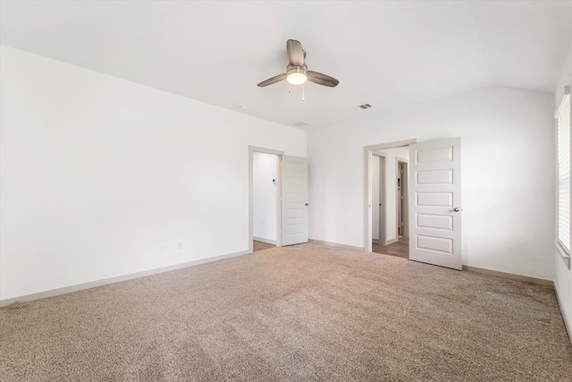 unfurnished bedroom with ceiling fan, carpet, and lofted ceiling