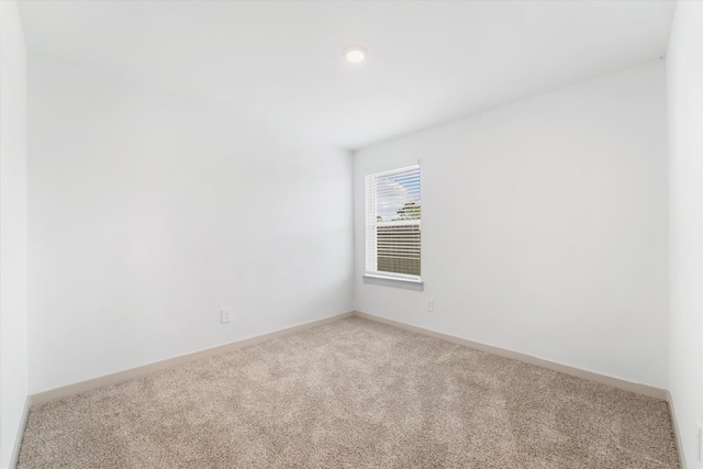 unfurnished room with carpet floors