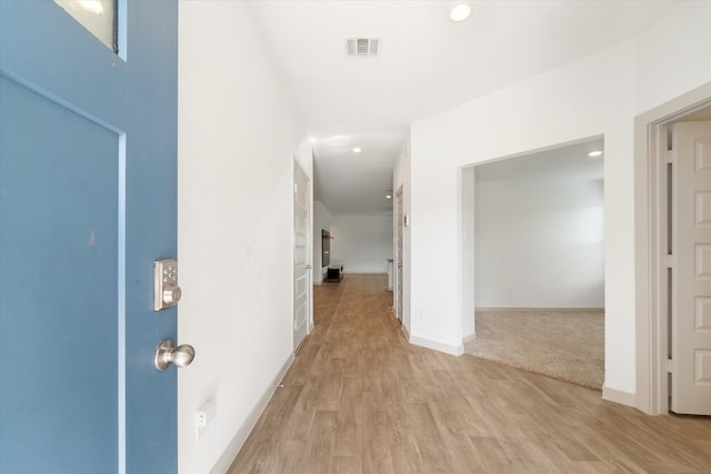 hall with light wood-type flooring