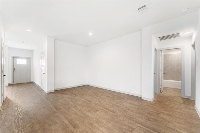 spare room with light wood-type flooring