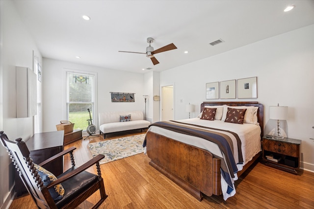 bedroom with hardwood / wood-style flooring and ceiling fan