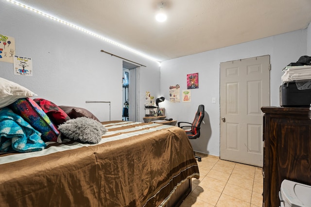 bedroom featuring light tile patterned floors