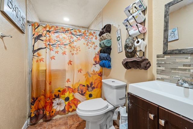 bathroom featuring decorative backsplash, a shower with shower curtain, a textured ceiling, vanity, and toilet