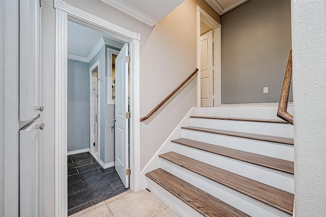 stairs featuring crown molding