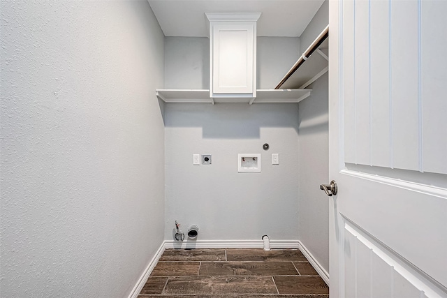 laundry area with dark wood-type flooring, cabinets, washer hookup, electric dryer hookup, and hookup for a gas dryer