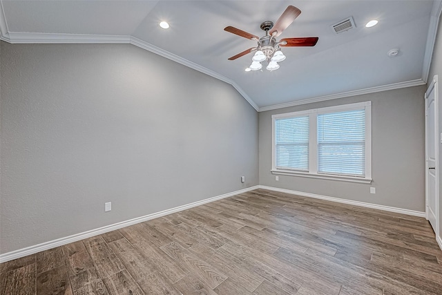 unfurnished room with ceiling fan, light wood-type flooring, lofted ceiling, and crown molding