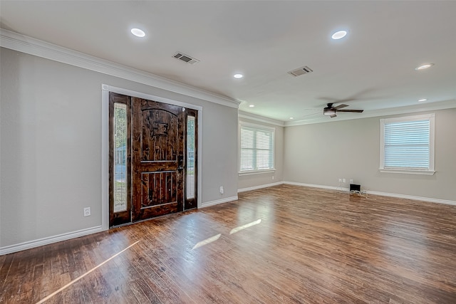 foyer with hardwood / wood-style flooring, ceiling fan, and ornamental molding