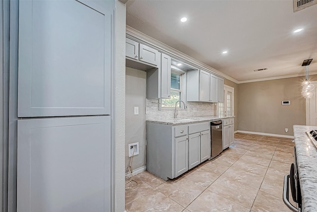 kitchen with sink, tasteful backsplash, light stone counters, crown molding, and decorative light fixtures