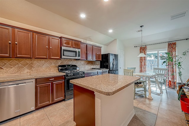 kitchen featuring visible vents, backsplash, black appliances, and light countertops