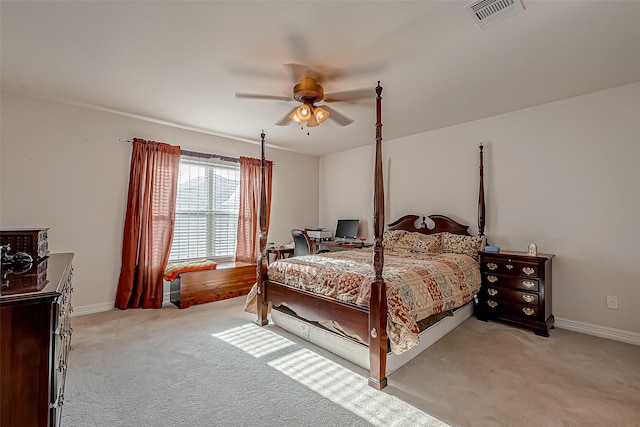 bedroom with visible vents, light colored carpet, a ceiling fan, and baseboards