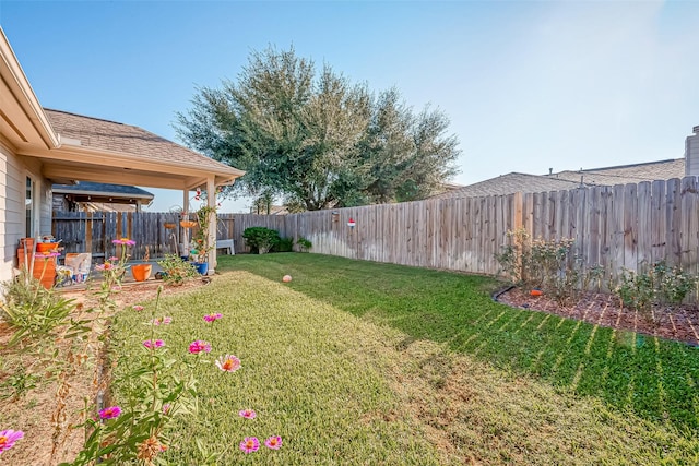 view of yard featuring a fenced backyard