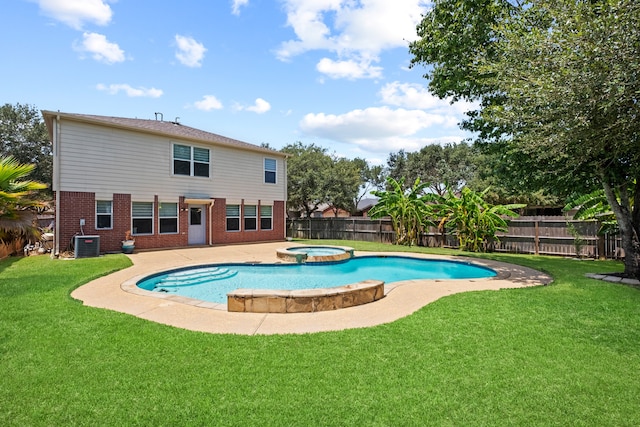 view of pool featuring a lawn, an in ground hot tub, and central AC unit