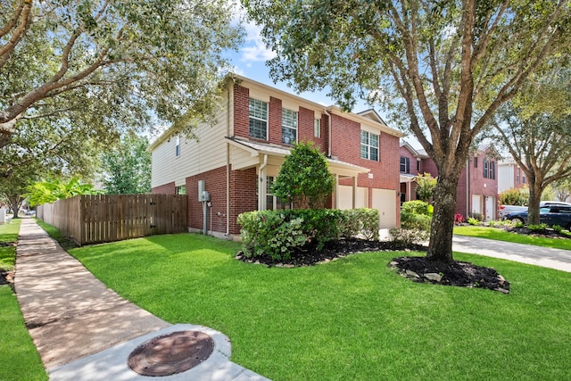 view of front facade featuring a front yard and a garage