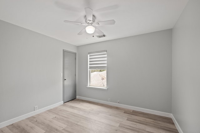 unfurnished room featuring ceiling fan and light wood-type flooring