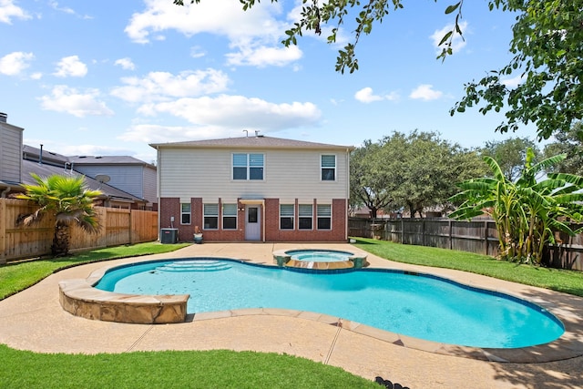 view of pool with central air condition unit and an in ground hot tub