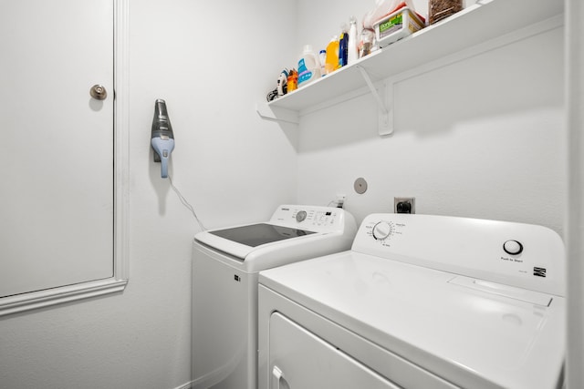 washroom with washing machine and clothes dryer