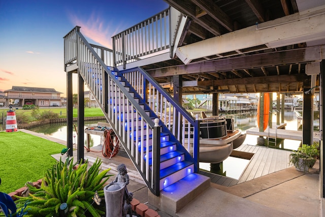 exterior space featuring a boat dock and a water view