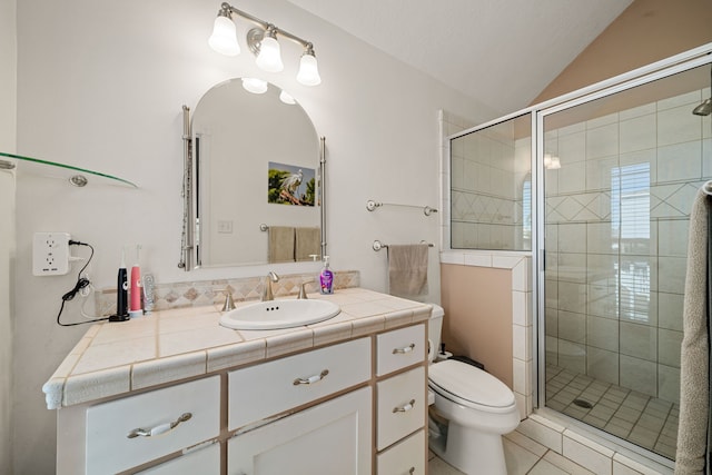 bathroom featuring tile patterned floors, an enclosed shower, vanity, toilet, and lofted ceiling