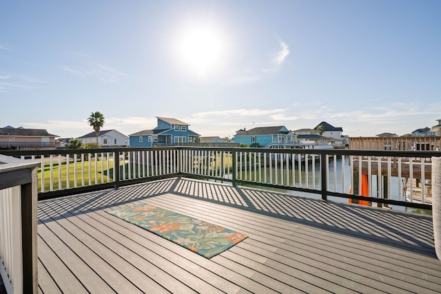 wooden deck featuring a water view