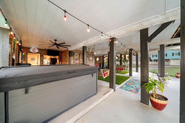 view of patio featuring a hot tub and ceiling fan